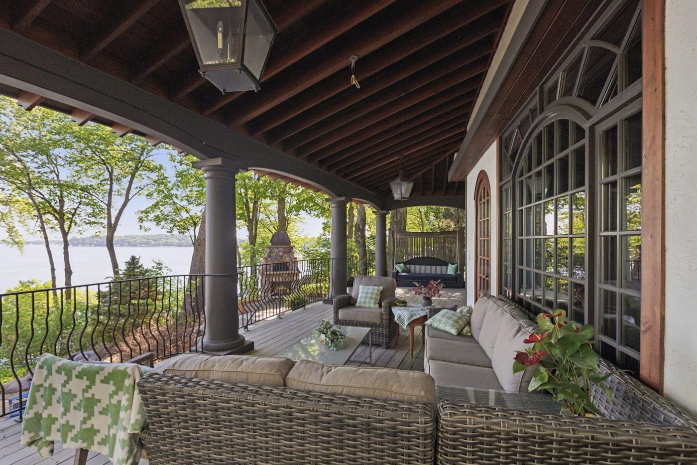 Covered lakeside porch, styled as living space